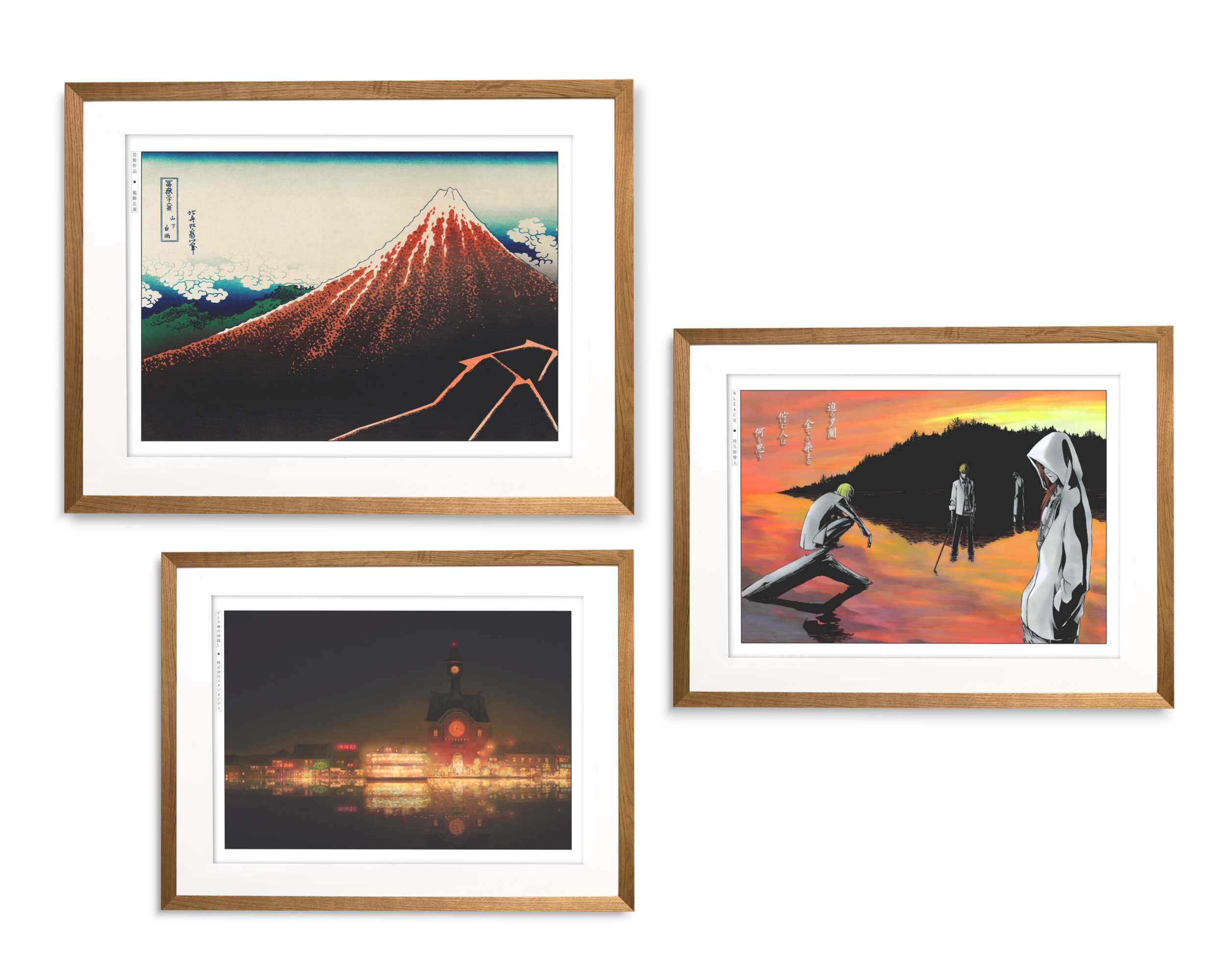 Framed anime and Japanese art prints in oak frames featuring Mount Fuji, a sunset scene, and a night city view