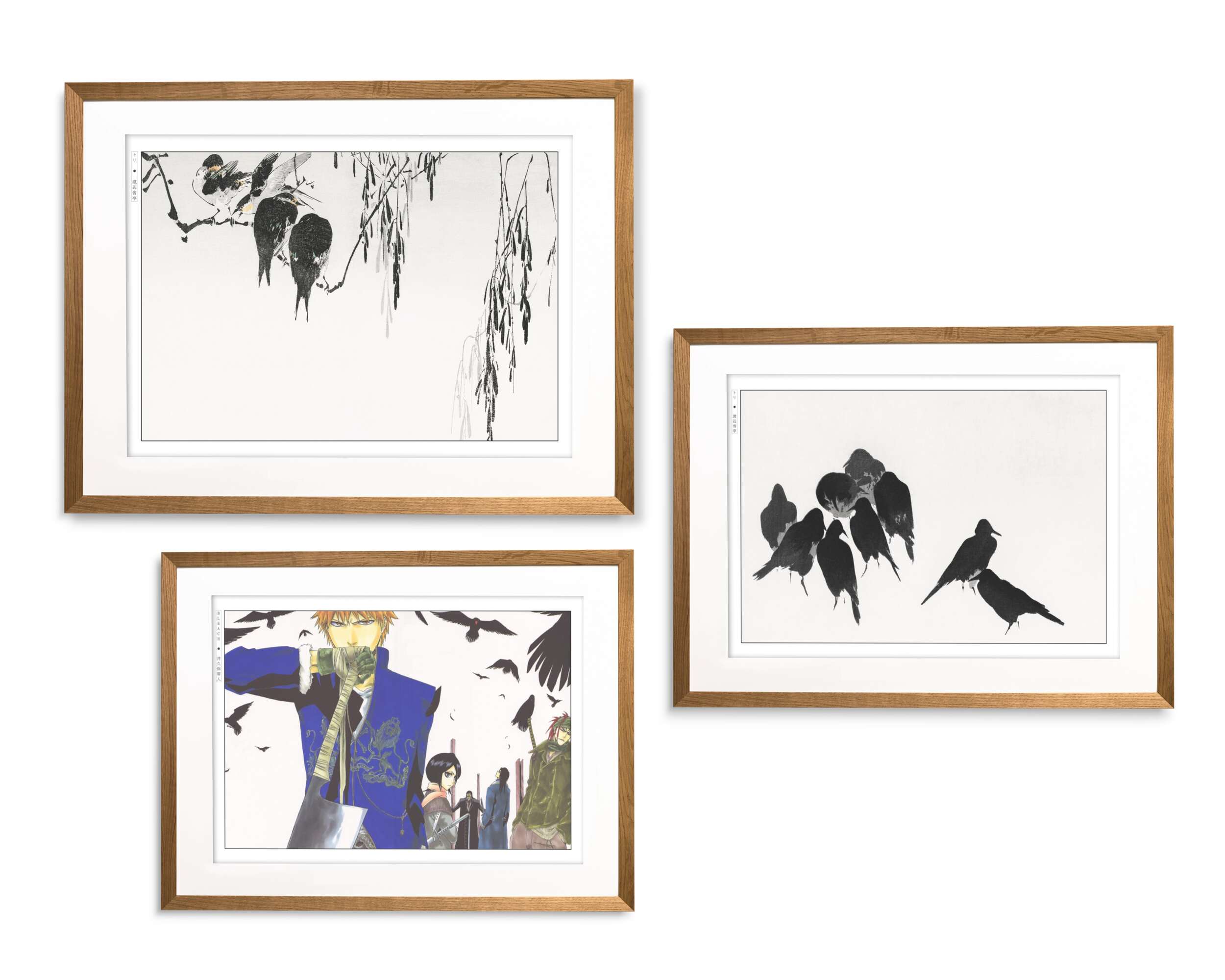 Gallery wall of framed Japanese art prints with minimalist ink birds and a modern illustrated print, displayed in oak frames